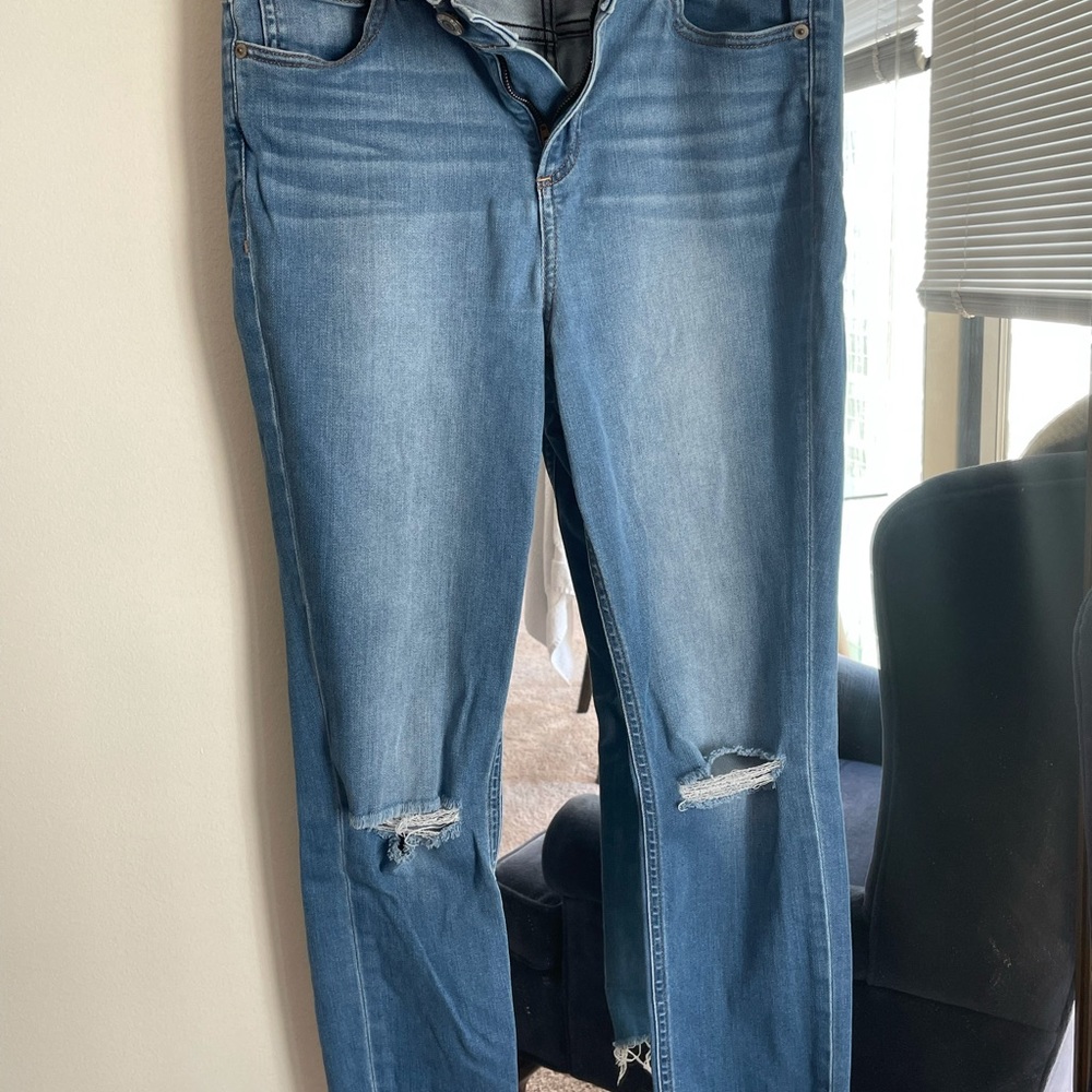 Express skinny jeans, rips in knees.